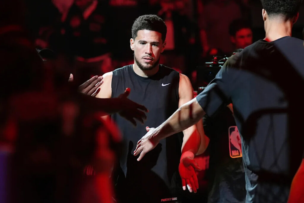 Suns’ All-Star guard Devin Booker changes jersey number to No. 15 in honor of his dad Melvin Suns’ All-Star guard Devin Booker changes jersey number to No. 15 in honor of his dad Melvin