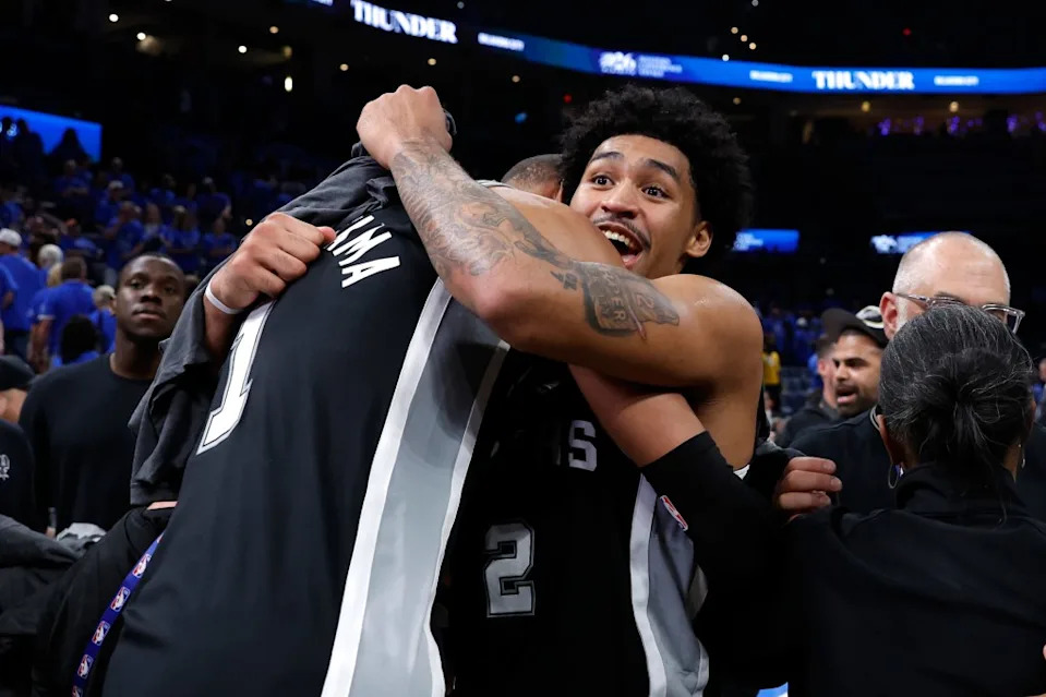Spurs forward Victor Wembanyama (1) and guard Dylan Harper (2) celebrate after defeating the Oklahoma City Thunder in Game 7. Alonzo Adams-Imagn Images