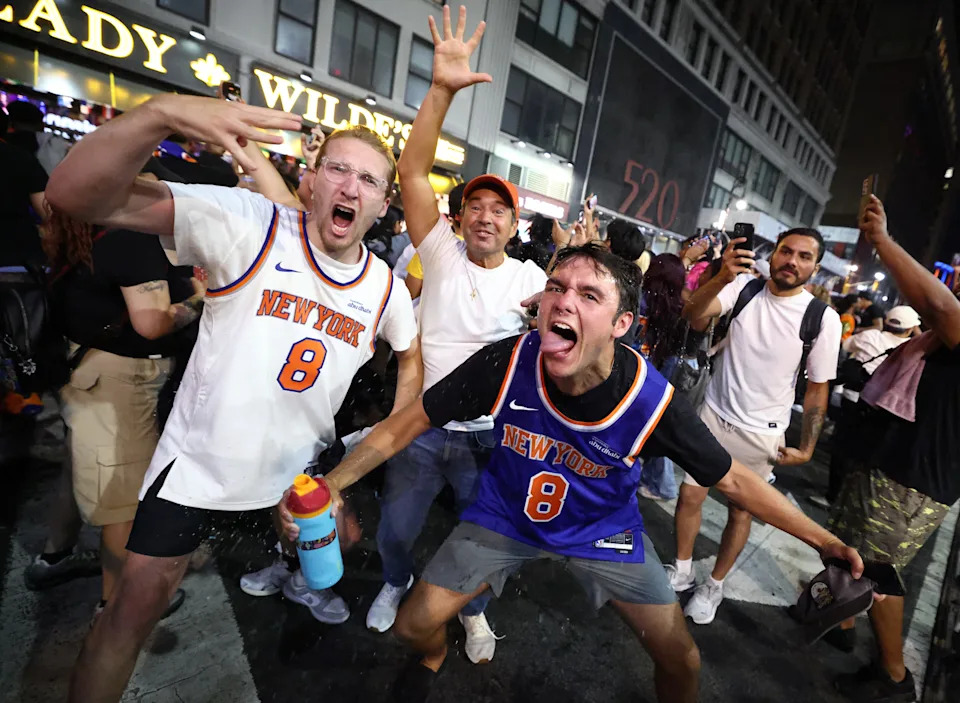 New York Knicks fans celebrate outside Madison Square Garden after their team's Game 4 victory over the San Antonio Spurs in the NBA Finals in New York on June 10, 2026.