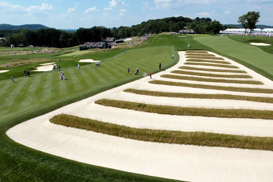 Bryson DeChambeau plays a shot out of the church pew bunkers on the fourth hole during the final round of the 2016 U.S. Open at Oakmont Country Club.