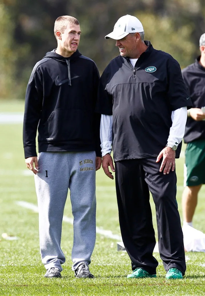 Jets head coach Rex Ryan talks with his son Seth during a practice <br>in 2012. Jeff Zelevansky