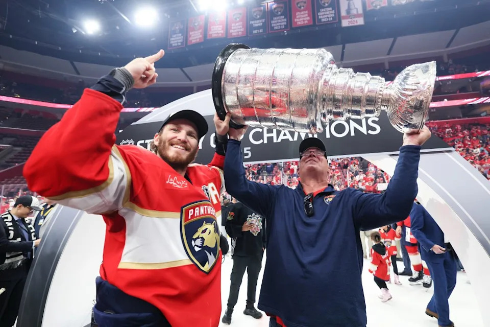 Keith Tkachuk celebrates with his son <a class="link " href="https://sports.yahoo.com/nhl/players/7114/" data-i13n="sec:content-canvas;subsec:anchor_text;elm:context_link" data-ylk="slk:Matthew Tkachuk;sec:content-canvas;subsec:anchor_text;elm:context_link;itc:0" data-yga="{"yLinkElement":"context_link","yModuleName":"content-canvas","yLinkText":"Matthew Tkachuk","ySubModuleName":"anchor_text","yHasCommerce":false}">Matthew Tkachuk</a> #19 of the Florida <a class="link " href="https://sports.yahoo.com/nhl/teams/florida/" data-i13n="sec:content-canvas;subsec:anchor_text;elm:context_link" data-ylk="slk:Panthers;sec:content-canvas;subsec:anchor_text;elm:context_link;itc:0" data-yga="{"yLinkElement":"context_link","yModuleName":"content-canvas","yLinkText":"Panthers","ySubModuleName":"anchor_text","yHasCommerce":false}">Panthers</a> after the Panthers defeated the Edmonton Oilers in Game Six of the 2025 Stanley Cup Final at Amerant Bank Arena on June 17, 2025. Getty Images