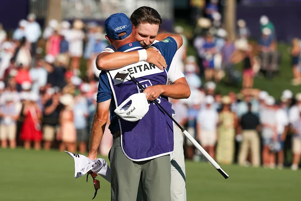 Kristoffer Reitan of Norway hugs his caddie on the 18th hole green after winning the Truist Championship 2026 at Quail Hollow Country Club on May 10, 2026 in Charlotte, North Carolina.
