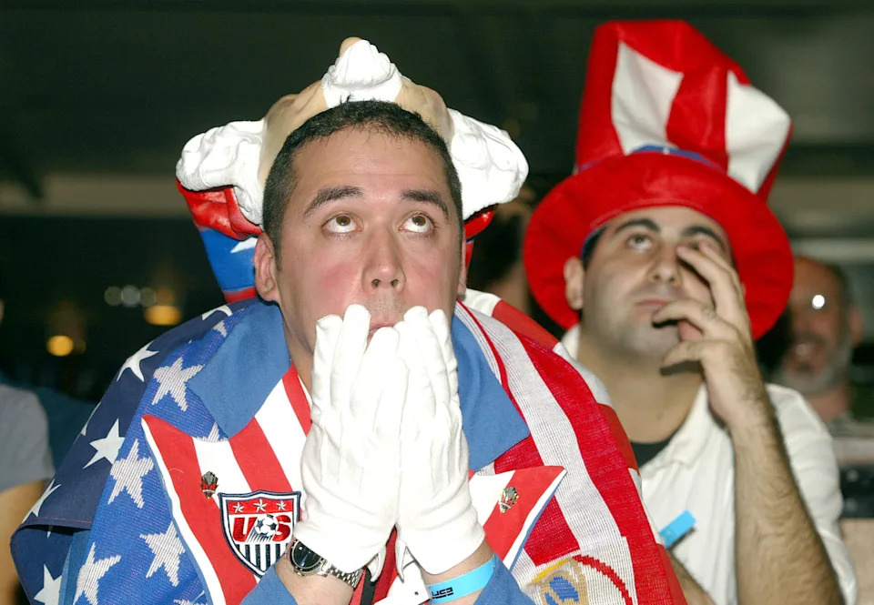 NEW YORK, UNITED STATES:  US soccer fans watch the the US vs. Germany 2002 FIFA World Cup soccer match 21 June 2002 in New York, NY. Germany, who defeated the US 1-0, will go on to play the winner of the South Korea vs. Spain match.          AFP PHOTO/Doug KANTER (Photo credit should read DOUG KANTER/AFP via Getty Images)