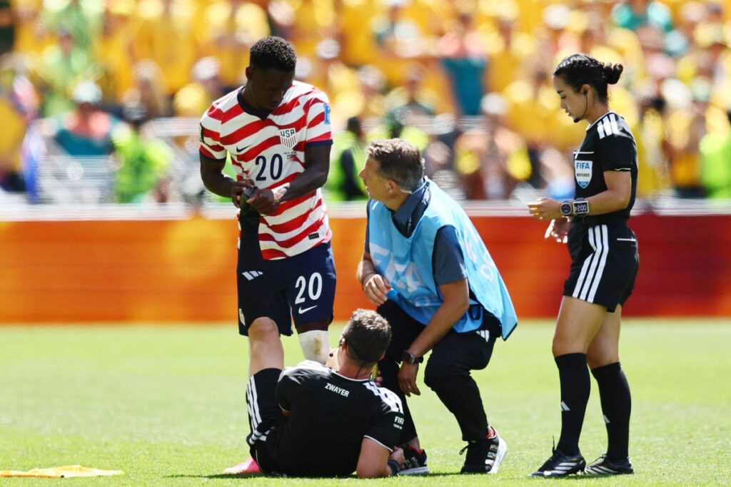 USA v Australia referee Felix Zwayer pulls up with cramp towards end of World Cup match USA v Australia referee Felix Zwayer pulls up with cramp towards end of World Cup match