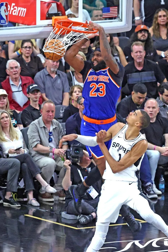 Mitchell Robinson dunks over <a class="link " href="https://sports.yahoo.com/nba/players/10094/" data-i13n="sec:content-canvas;subsec:anchor_text;elm:context_link" data-ylk="slk:Victor Wembanyama;sec:content-canvas;subsec:anchor_text;elm:context_link;itc:0" data-yga="{"yLinkElement":"context_link","yModuleName":"content-canvas","yLinkText":"Victor Wembanyama","ySubModuleName":"anchor_text","yHasCommerce":false}">Victor Wembanyama</a> in Game 2. Charles Wenzelberg / New York Post