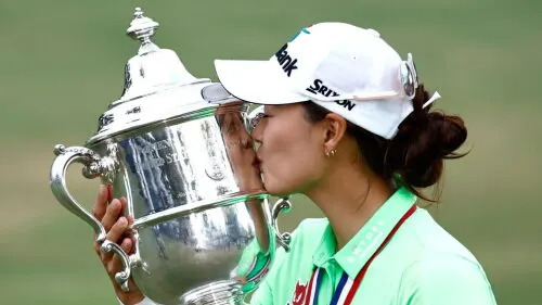 Minjee Lee kisses her trophy after winning the 2022 U.S. Women's Open, the largest ever payout in women's golf