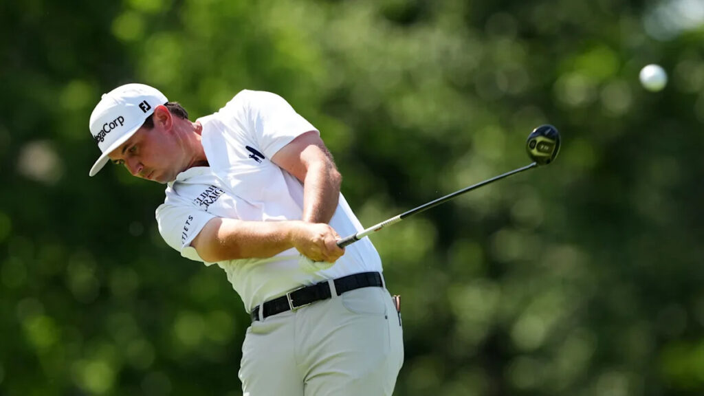 J.T. Poston handles the wind at Memorial for low round of tournament and the lead