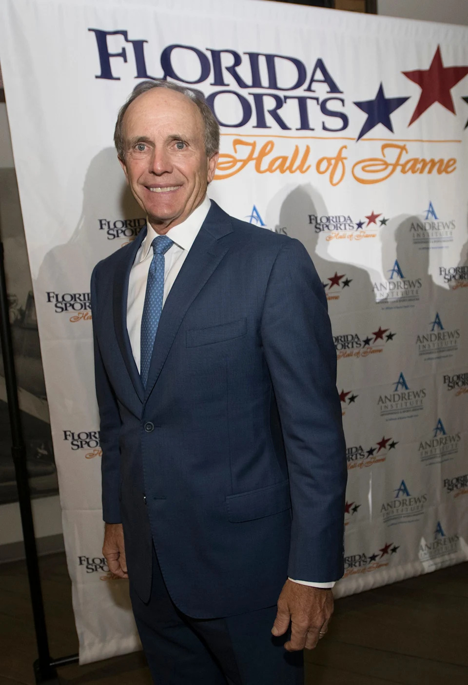 Pensacola own, Jerry Pate, poses for photographs before the start of Wednesday night’s 2018 Florida Sports Hall of Fame Enshrinement Ceremony at the National Naval Aviation Museum. 