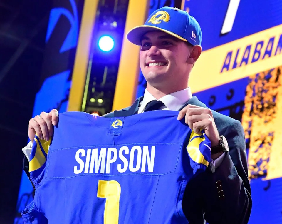 University of Alabama quarterback Ty Simpson holds his new jersey after being picked by the Los Angeles Rams in the first round Archie Carpenter/UPI/Shutterstock