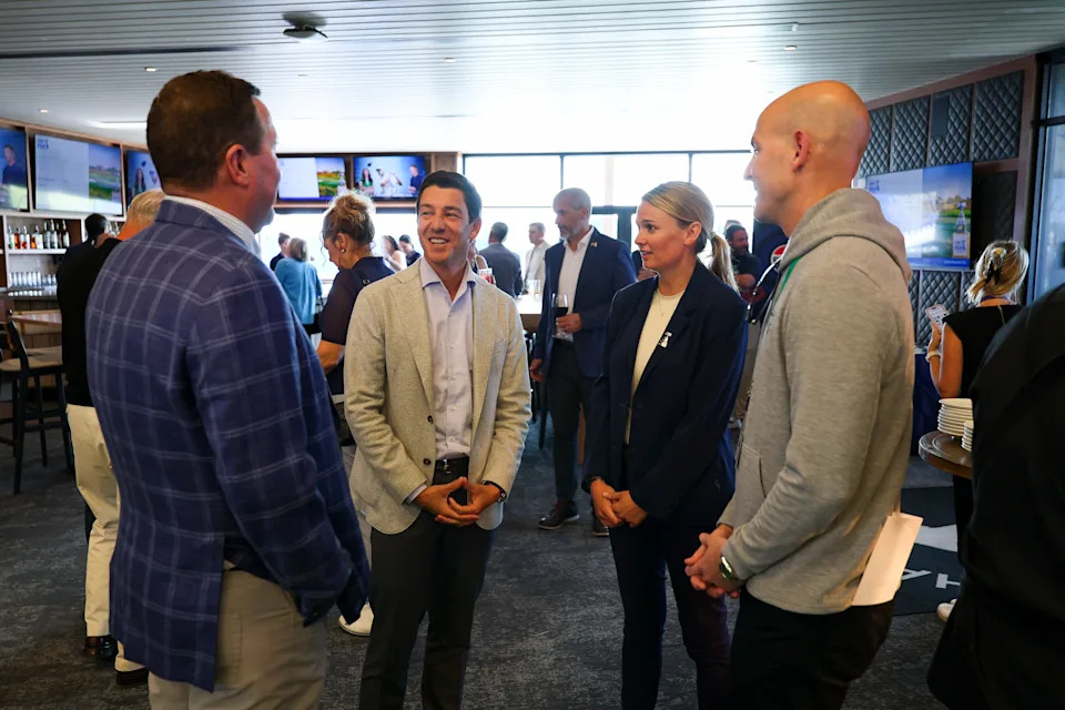 LPGA Commissioner Craig Kessler and Championship Director at PGA of America Laura Frick, PGA, speak with attendees during the KPMG Women's PGA Championship Pro-Am Pairings Party at Hazeltine National Golf Club on Monday, June 22, 2026 in Chaska, Minnesota.