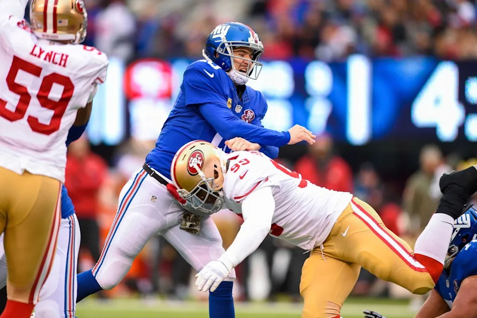 <a class="link " href="https://sports.yahoo.com/nfl/teams/ny-giants/" data-i13n="sec:content-canvas;subsec:anchor_text;elm:context_link" data-ylk="slk:New York Giants;sec:content-canvas;subsec:anchor_text;elm:context_link;itc:0" data-yga="{"yLinkElement":"context_link","yModuleName":"content-canvas","yLinkText":"New York Giants","ySubModuleName":"anchor_text","yHasCommerce":false}">New York Giants</a> quarterback <a class="link " href="https://sports.yahoo.com/nfl/players/6760/" data-i13n="sec:content-canvas;subsec:anchor_text;elm:context_link" data-ylk="slk:Eli Manning;sec:content-canvas;subsec:anchor_text;elm:context_link;itc:0" data-yga="{"yLinkElement":"context_link","yModuleName":"content-canvas","yLinkText":"Eli Manning","ySubModuleName":"anchor_text","yHasCommerce":false}">Eli Manning</a> (10) is hit by San Francisco 49ers outside linebacker Aldon Smith (99) during the first half of a NFL game between the San Francisco 49ers and the New York Giants at MetLife Stadium in East Rutherford, NJ. Corbis/Icon Sportswire via Getty