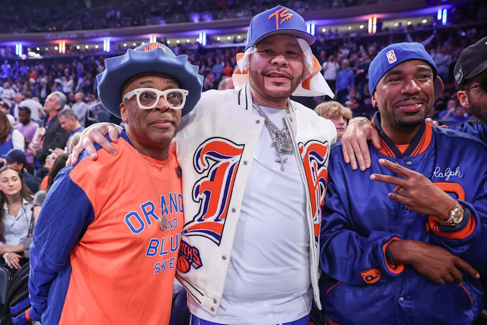 Actor and filmmaker Spike Lee (l), hip hop artists Fat Joe (c) and N.O.R.E (r) watch Game 3 of the 2025 NBA Playoffs series between the Boston Celtics and the New York Knicks at Madison Square Garden