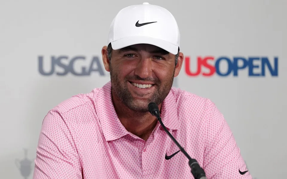 A smiling Scottie Scheffler talks to reporters after his U.S. Open practice round on June 16, 2026. Getty Images