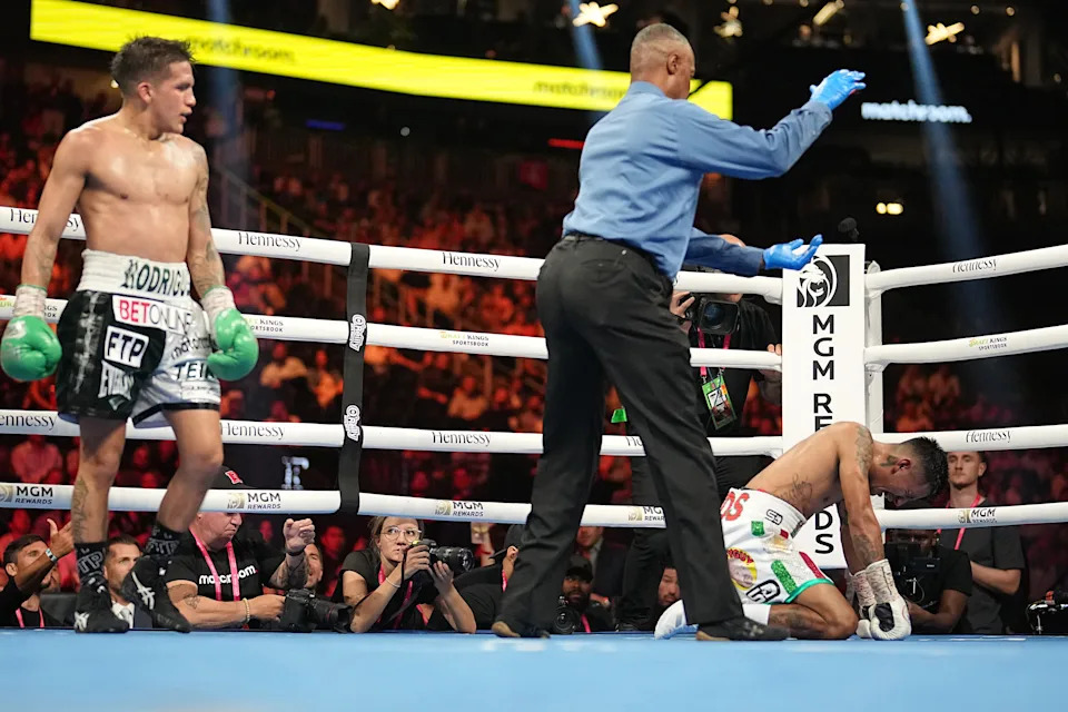 Boxing: WBC World Super Flyweight Title:  Israel Gonzalez (R) is knocked down by Jesse Rodriguez (L) during fight at T-Mobile Arena. Las Vegas, NV 9/17/2022 CREDIT: Erick W. Rasco (Photo by Erick W. Rasco/Sports Illustrated via Getty Images)(Set Number: X164164 TK1)