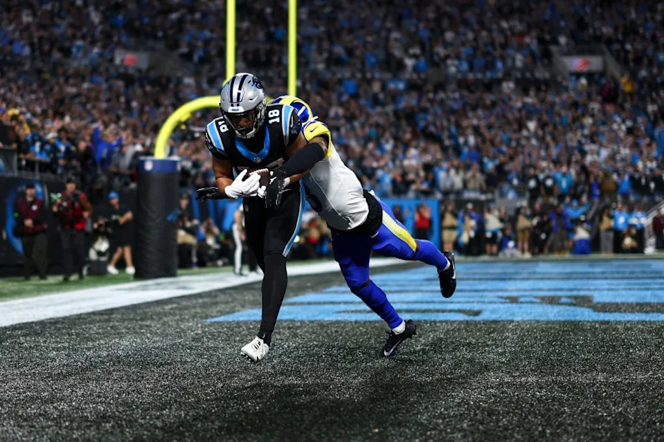 Jalen Coker of the Carolina Panthers catches a pass to score a touchdown as <a class="link " href="https://sports.yahoo.com/nfl/players/32886/" data-i13n="sec:content-canvas;subsec:anchor_text;elm:context_link" data-ylk="slk:Kam Curl;sec:content-canvas;subsec:anchor_text;elm:context_link;itc:0" data-yga="{"yLinkElement":"context_link","yModuleName":"content-canvas","yLinkText":"Kam Curl","ySubModuleName":"anchor_text","yHasCommerce":false}">Kam Curl</a> #3 of the <a class="link " href="https://sports.yahoo.com/nfl/teams/la-rams/" data-i13n="sec:content-canvas;subsec:anchor_text;elm:context_link" data-ylk="slk:Los Angeles Rams;sec:content-canvas;subsec:anchor_text;elm:context_link;itc:0" data-yga="{"yLinkElement":"context_link","yModuleName":"content-canvas","yLinkText":"Los Angeles Rams","ySubModuleName":"anchor_text","yHasCommerce":false}">Los Angeles Rams</a> defends during an NFL wild card playoff football game at Bank of America Stadium on January 10, 2026 in Charlotte, North Carolina. Getty Images