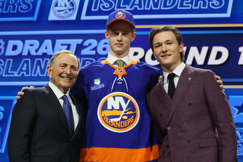 NHL commissioner Gary Bettman and <a class="link " href="https://sports.yahoo.com/nhl/players/33423/" data-i13n="sec:content-canvas;subsec:anchor_text;elm:context_link" data-ylk="slk:Matthew Schaefer;sec:content-canvas;subsec:anchor_text;elm:context_link;itc:0" data-yga="{"yLinkElement":"context_link","yModuleName":"content-canvas","yLinkText":"Matthew Schaefer","ySubModuleName":"anchor_text","yHasCommerce":false}">Matthew Schaefer</a> of the New York Islanders looks on as Malte Gustafsson of Sweden (center) is drafted by the Islanders with the No. 13 overall pick during on Day 1 of the 2026 NHL Draft on June 26, 2026 in Buffalo. Getty Images