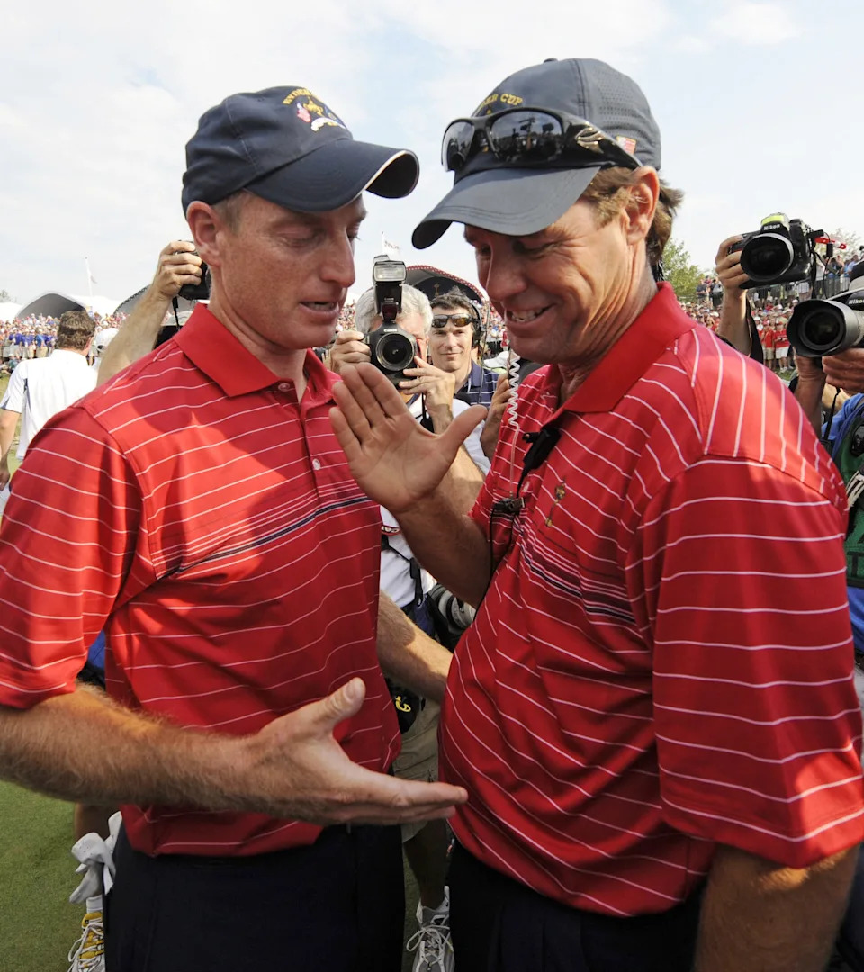 Captain Paul Azinger (R) and Jim Furyk of Team USA congratulate one another on the 17th green at the end of the Ryder Cup competition on September 21, 2008 at Valhalla in Louisville, Kentucky. Team USA won the cup.