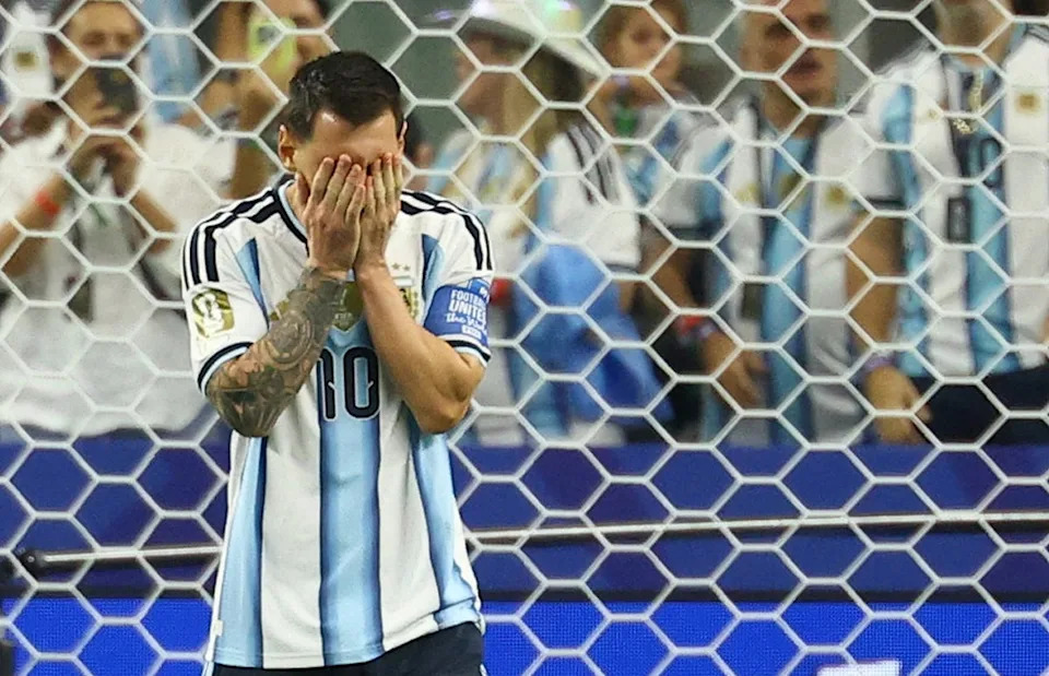 Messi reacts after missing a penalty against Austria (Reuters)