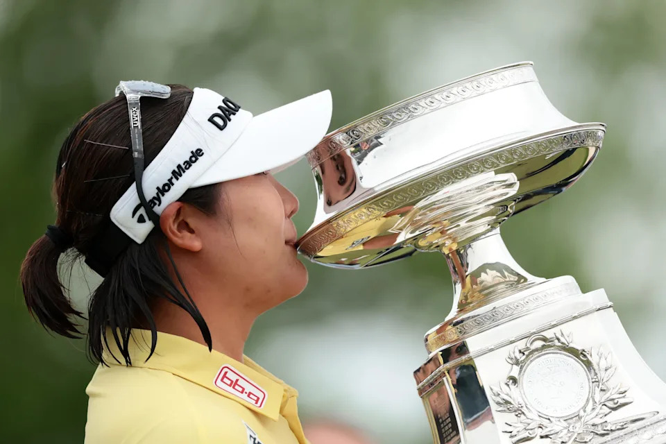 Haeran Ryu kisses the trophy after winning the 2026 KPMG Women's PGA Championship at Hazeltine National Golf Club.