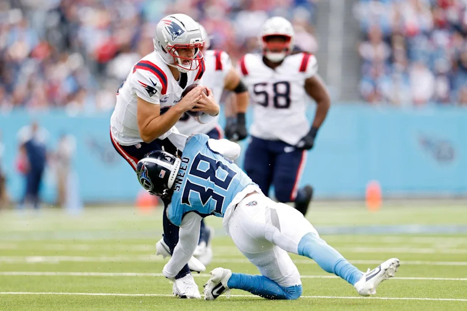L’Jarius Sneed of the Tennessee Titans tackles <a class="link " href="https://sports.yahoo.com/nfl/players/40881/" data-i13n="sec:content-canvas;subsec:anchor_text;elm:context_link" data-ylk="slk:Drake Maye;sec:content-canvas;subsec:anchor_text;elm:context_link;itc:0" data-yga="{"yLinkElement":"context_link","yModuleName":"content-canvas","yLinkText":"Drake Maye","ySubModuleName":"anchor_text","yHasCommerce":false}">Drake Maye</a> of the New England Patriots during the first quarter of the game at Nissan Stadium on October 19, 2025. Getty Images
