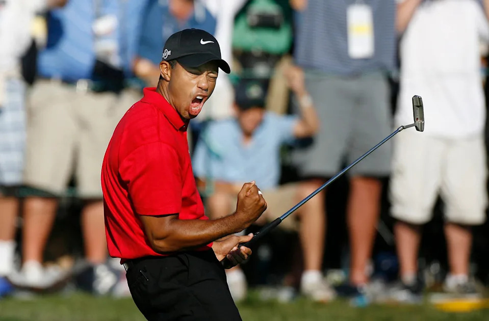 Tiger Woods celebrates after making a birdie on the 18th green to tie Rocco Mediate for the lead and force an 18 hole playoff at the final round of the 2008 US Open Championship at Torrey Pines.