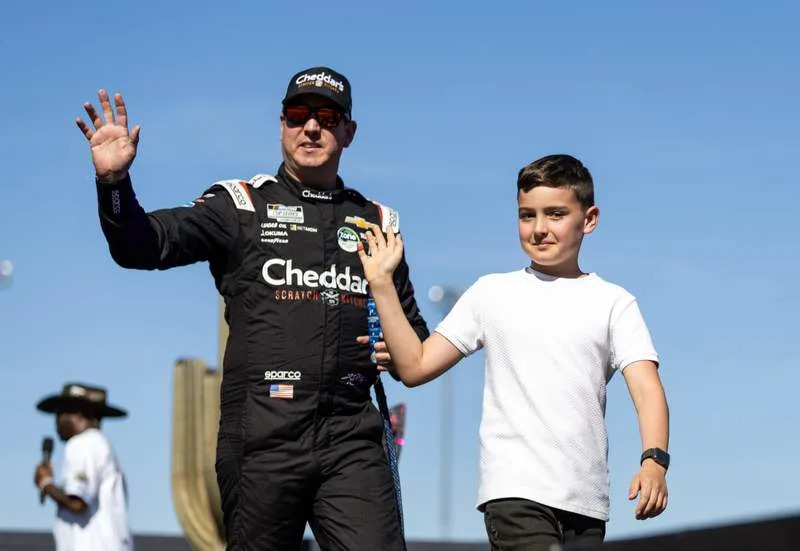 Nov 2, 2025; Avondale, Arizona, USA; NASCAR Cup Series driver Kyle Busch with son Brexton Busch during the NASCAR Championship race at Phoenix Raceway. Mandatory Credit: Mark J. Rebilas-Imagn Images