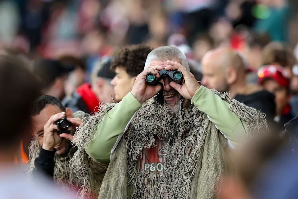 A Southampton fan in camouflage attire during the second leg of his side's Championship semi-final against Middlesbrough