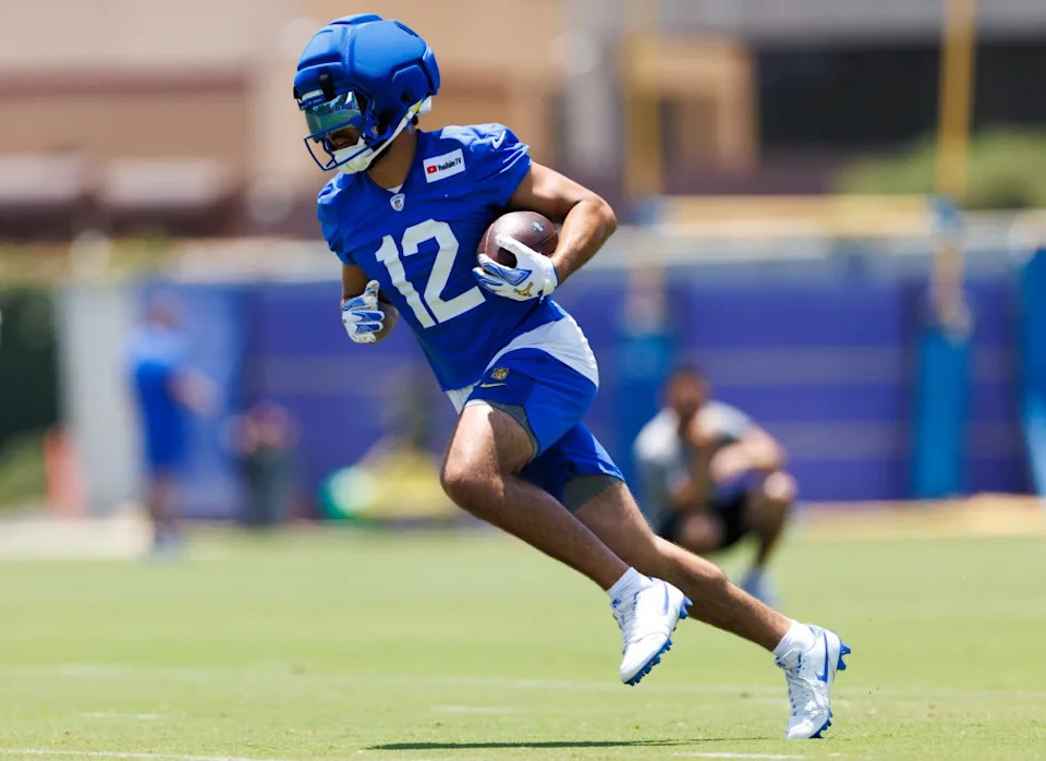 Puka Nacua #12 of the Los Angeles Rams runs after the catch during an OTA offseason workout at Rams Village. Getty Images