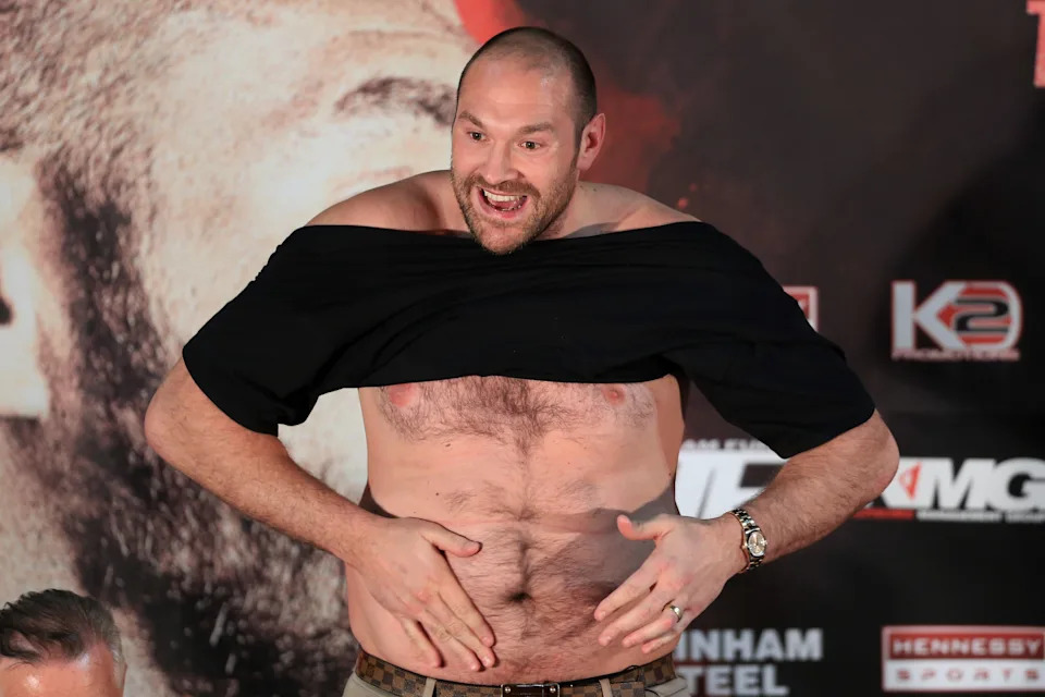 27th April 2016 - World Heavyweight Boxing - Press Conference - Tyson Fury & Wladimir Klitschko - Tyson Fury stands with a bare chest speaking about his weight - (Photo by Simon Stacpoole/Offside/Getty Images).