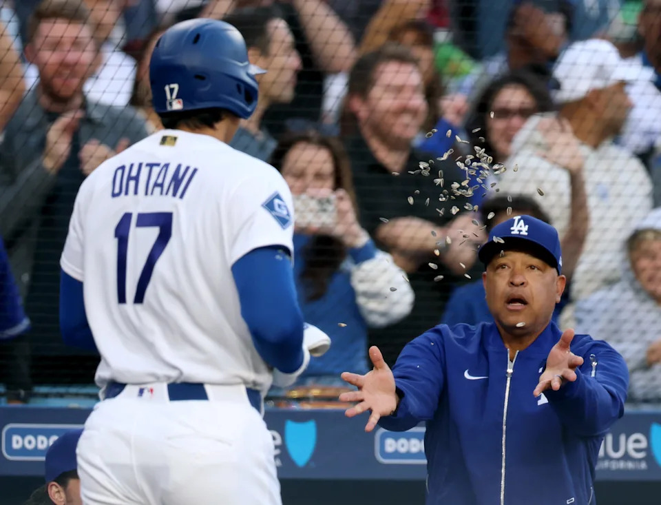 Los Angeles Dodgers manager Dave Roberts (right) celebrates a solo home run from Shohei Ohtani (17) against the Colorado Rockies at Dodger Stadium on May 27, 2026.