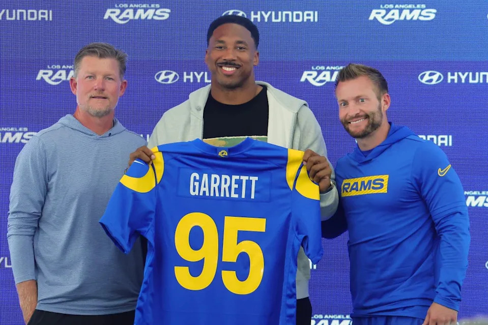 From left: Rams GM Les Snead, Myles Garrett and head coach Sean McVay during a press conference introducing Garrett on June 2, 2026. Getty Images