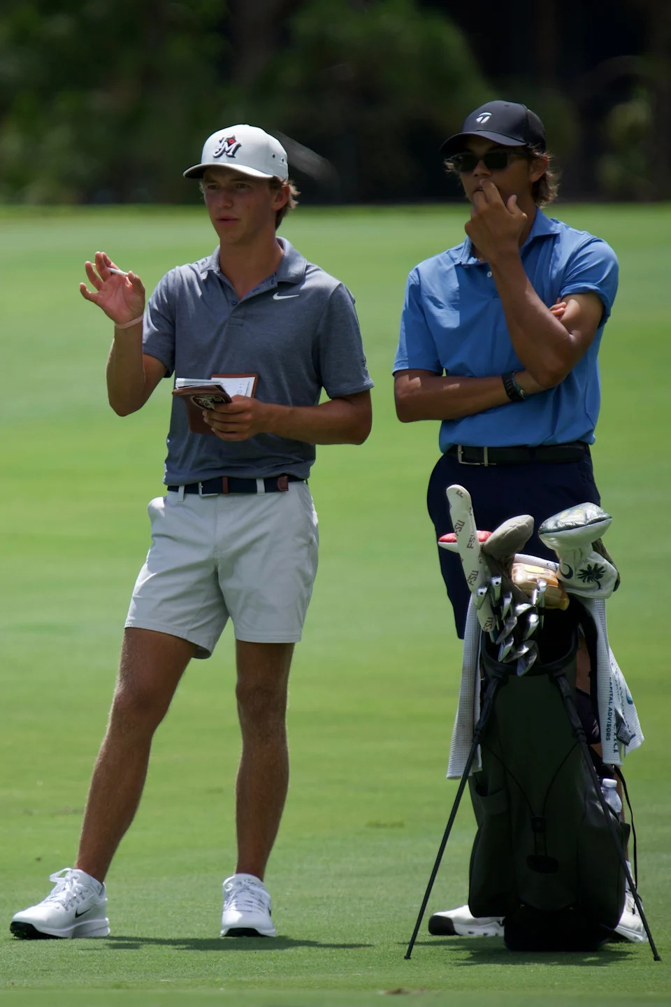 Miles Russell (left) plays a U.S. Open qualifier with Charlie Woods (right) as his caddy on Monday, June 8 at the BallenIsles Country Club (East) in Palm Beach Gardens, Florida.