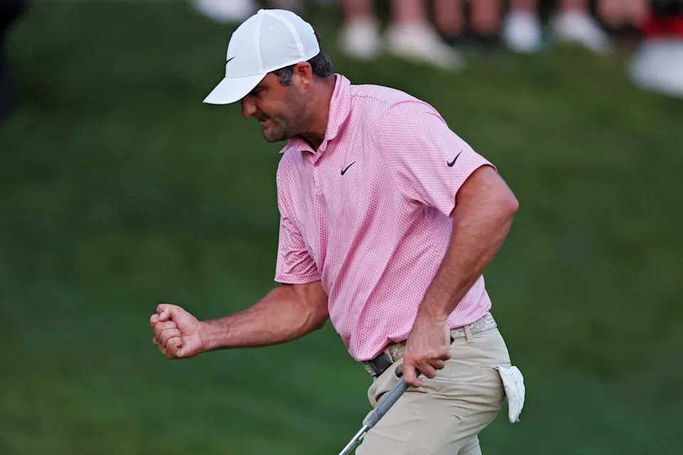 Scottie Scheffler reacts after making par on the 18th green Sunday at the Travelers Championship.