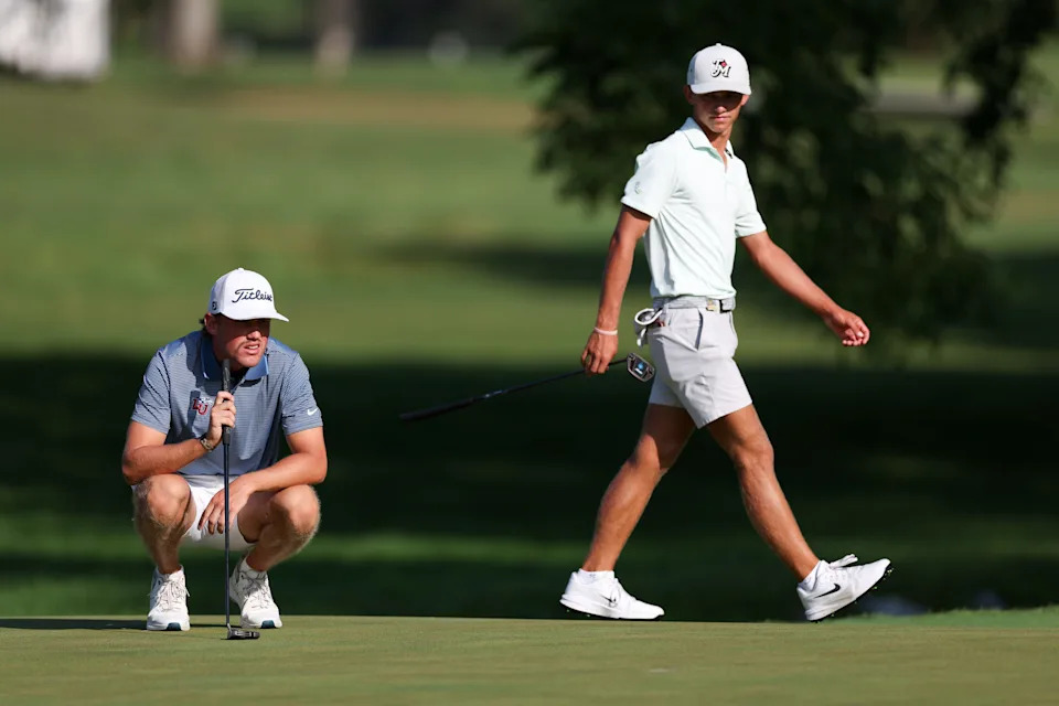 Noah Maclauchlan reads his putt on the fourth hole as Miles Russell of Jacksonville Beach walks behind him during the finals of the 2026 U.S. Junior Amateur at Saucon Valley C.C. (Old Course) in Bethlehem, Pa. on Saturday, July 25, 2026. (Ishika Samant/USGA)