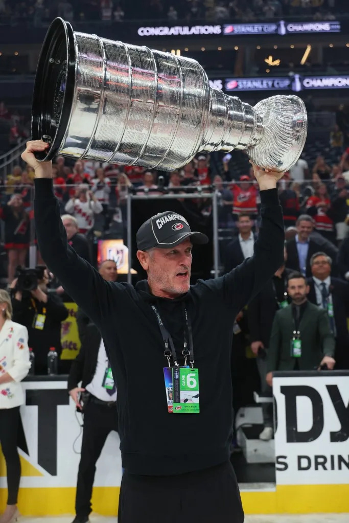 Carolina Hurricanes owner Tom Dundon holds the Stanley Cup. Getty Images