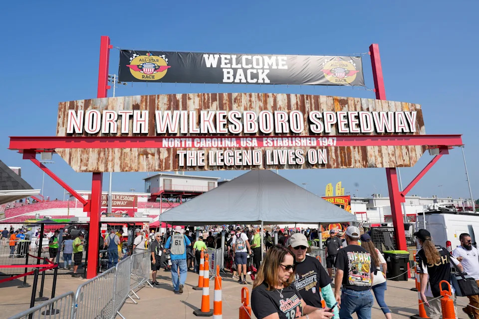 Fans stream into the entrance of North Wilkesboro Speedway for NASCAR All-Star Race weekend on May 21, 2023.
