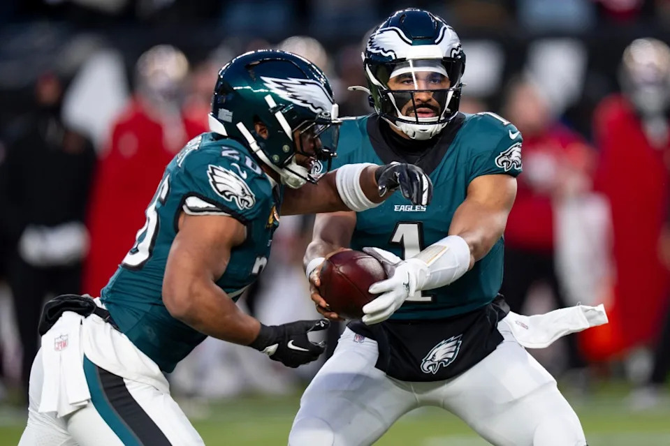 <a class="link " href="https://sports.yahoo.com/nfl/players/32723/" data-i13n="sec:content-canvas;subsec:anchor_text;elm:context_link" data-ylk="slk:Jalen Hurts;sec:content-canvas;subsec:anchor_text;elm:context_link;itc:0" data-yga="{"yLinkElement":"context_link","yModuleName":"content-canvas","yLinkText":"Jalen Hurts","ySubModuleName":"anchor_text","yHasCommerce":false}">Jalen Hurts</a> hands the ball off to <a class="link " href="https://sports.yahoo.com/nfl/players/30972/" data-i13n="sec:content-canvas;subsec:anchor_text;elm:context_link" data-ylk="slk:Saquon Barkley;sec:content-canvas;subsec:anchor_text;elm:context_link;itc:0" data-yga="{"yLinkElement":"context_link","yModuleName":"content-canvas","yLinkText":"Saquon Barkley","ySubModuleName":"anchor_text","yHasCommerce":false}">Saquon Barkley</a> during the Eagels’ wild-card loss to the 49ers on Jan. 11, 2026, in Philadelphia. AP Photo/Chris Szagola
