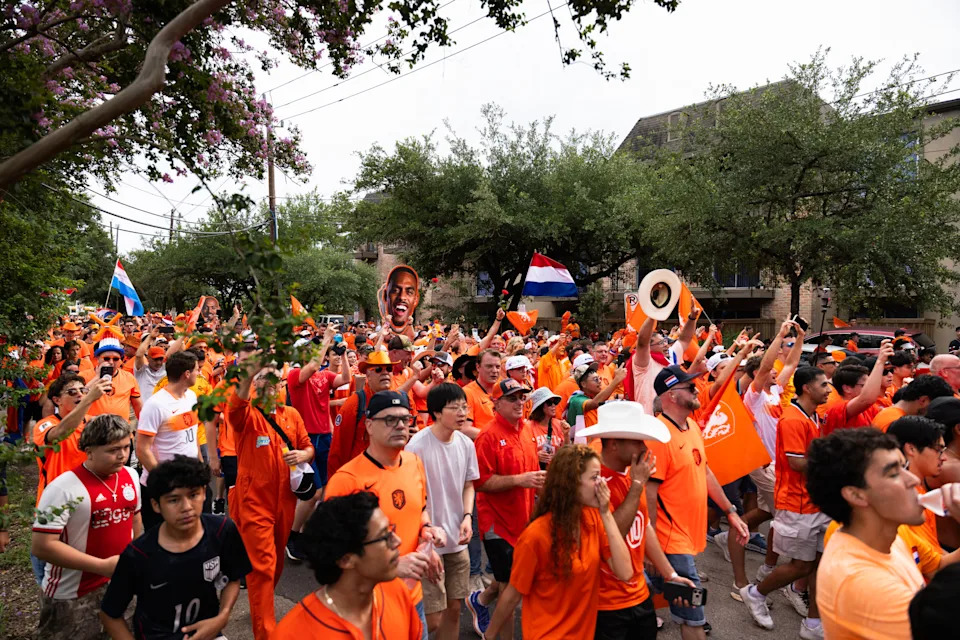 Fans wear orange and march across Houston, Texas, during the Oranje Walk ahead of a World Cup match between the Netherlands and Sweden on June 20, 2026. (Photo by Reginald Mathalone/NurPhoto via Getty Images)