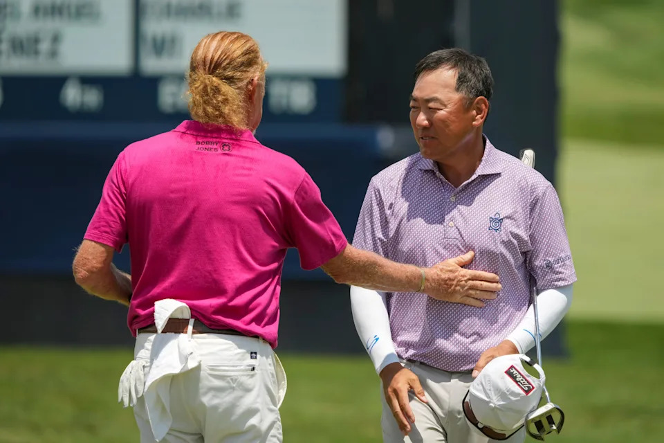 Miguel Angel Jimenez shakes hands with Charlie Wi on 18 during the third round of the U.S. Senior Open at Scioto Country Club in Columbus on July 4, 2026.