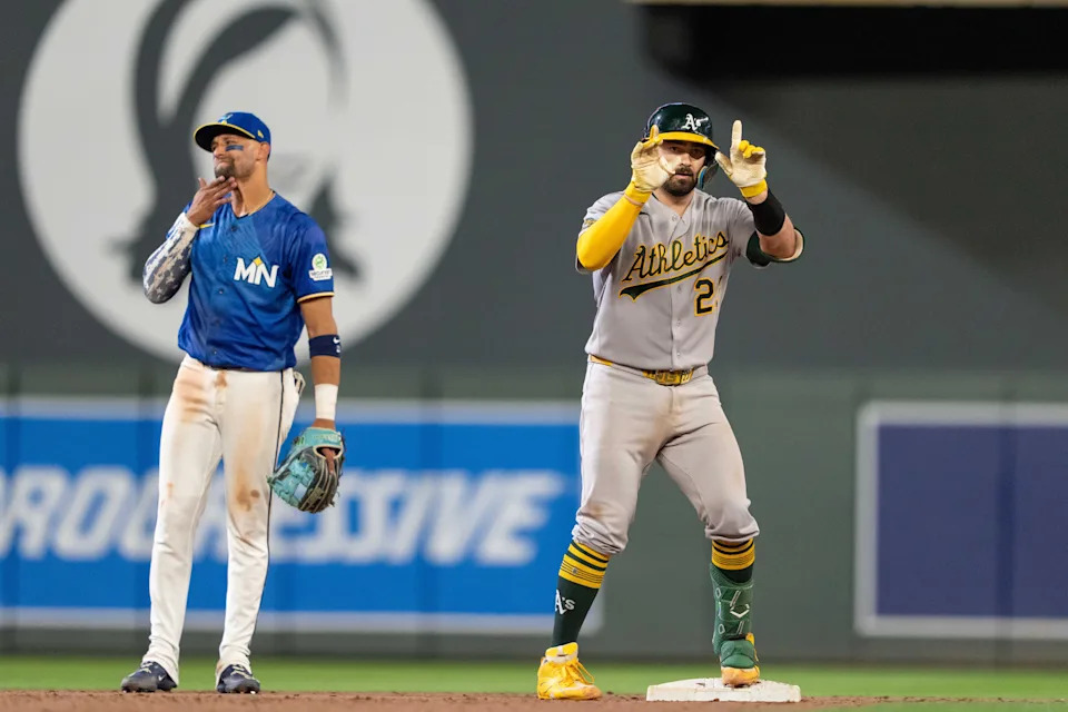 Athletics catcher Shea Langeliers (23) reacts after hitting into a ground rule double during the ninth inning against the Minnesota Twins at Target Field.