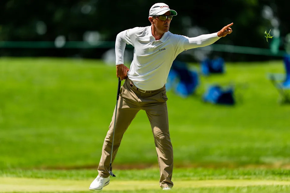 Mike Weir tosses grass to his caddie at the 18th green during round 1 of the Kaulig Companies PGA Championship, July 9, 2026, at Firestone Country Club in Akron, Ohio.