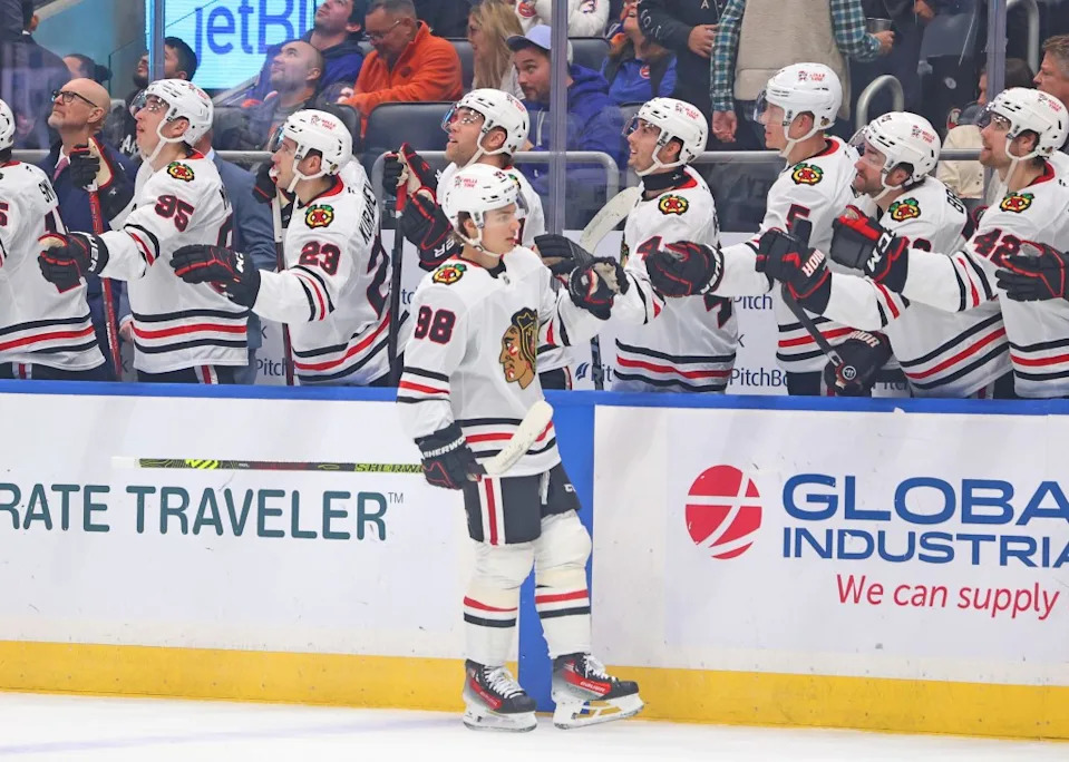 Connor Bedard of the Chicago Blackhawks is greeted by his teammates on the bench after he scores a goal during the first period when the <a class="link " href="https://sports.yahoo.com/nhl/teams/ny-islanders/" data-i13n="sec:content-canvas;subsec:anchor_text;elm:context_link" data-ylk="slk:New York Islanders;sec:content-canvas;subsec:anchor_text;elm:context_link;itc:0" data-yga="{"yLinkElement":"context_link","yModuleName":"content-canvas","yLinkText":"New York Islanders","ySubModuleName":"anchor_text","yHasCommerce":false}">New York Islanders</a> played the Chicago Blackhawks on Thursday, December 12, 2024 at UBS Arena in Elmont, NY. Robert Sabo for NY Post
