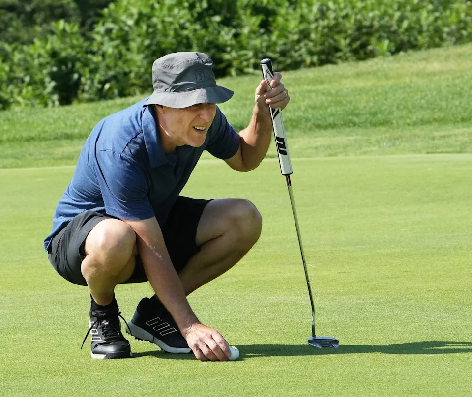 Pierre Bouchard carefully lines up a putt at last year's Luck O' the Irish Jimmy Fund Classic at Pease Golf Course.