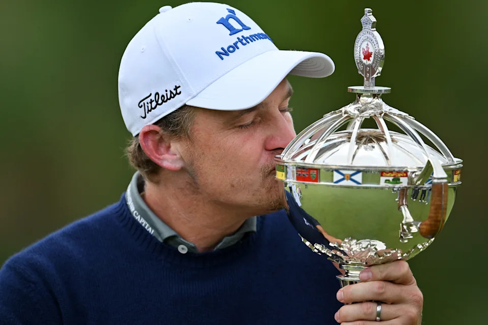 Bud Cauley kisses the trophy after winning the 2026 RBC Canadian Open at TPC Toronto.