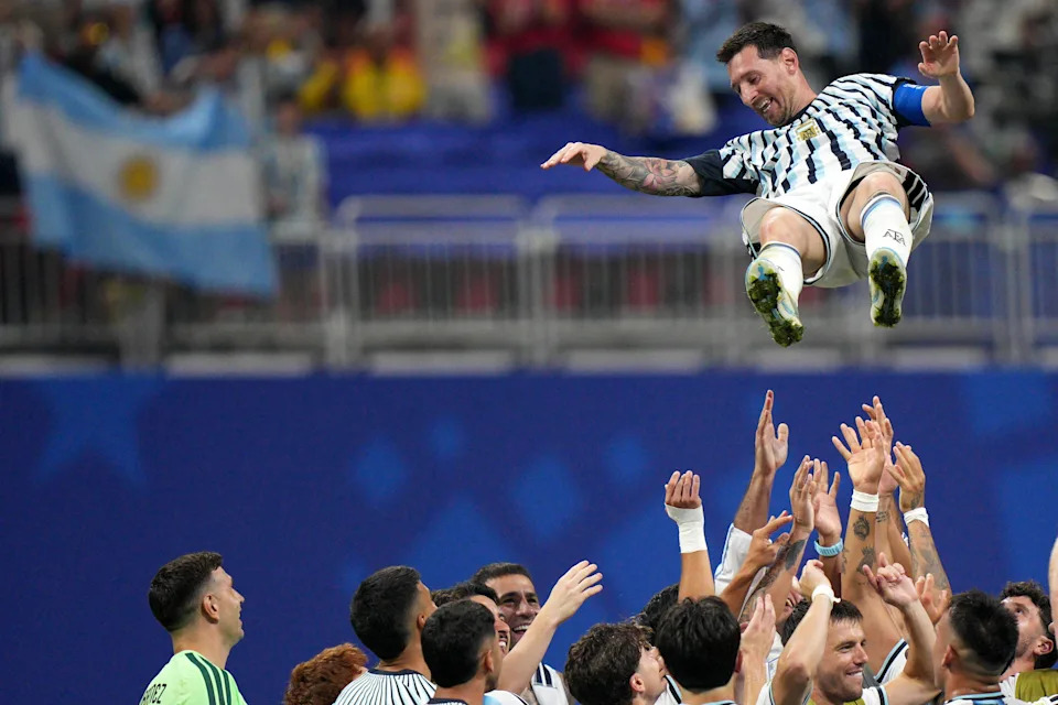 Argentina players toss teammate Lionel Messi (10) into the air as they celebrate after the World Cup round of 16 soccer match between Argentina and Egypt in Atlanta, Tuesday, July 7, 2026. (AP Photo/Jacob Kupferman)