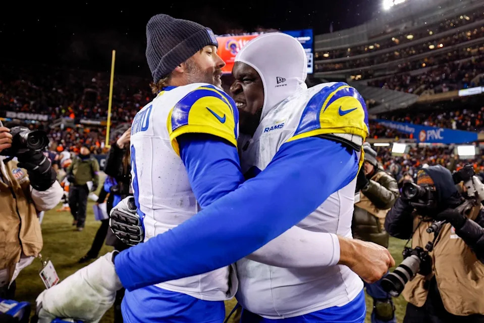 Matthew Stafford #9 and Kevin Dotson #69 of the Los Angeles Rams celebrate after the NFC Divisional playoff game against the <a class="link " href="https://sports.yahoo.com/nfl/teams/chicago/" data-i13n="sec:content-canvas;subsec:anchor_text;elm:context_link" data-ylk="slk:Chicago Bears;sec:content-canvas;subsec:anchor_text;elm:context_link;itc:0" data-yga="{"yLinkElement":"context_link","yModuleName":"content-canvas","yLinkText":"Chicago Bears","ySubModuleName":"anchor_text","yHasCommerce":false}">Chicago Bears</a> Getty Images