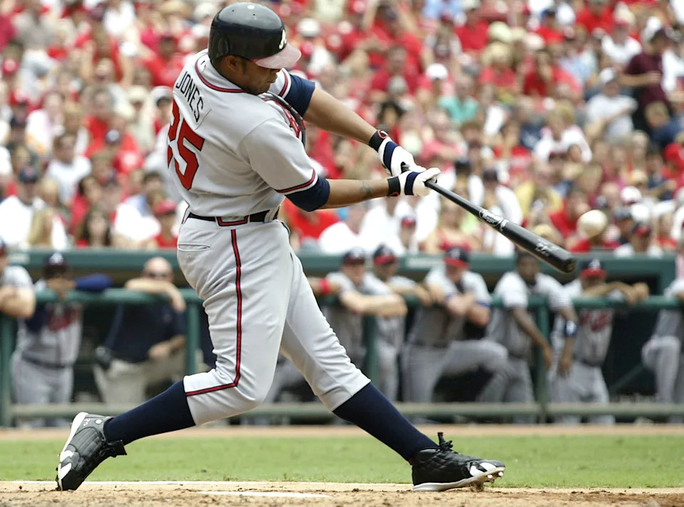ST. LOUIS - AUGUST 6: Outfielder Andruw Jones #25 of the Atlanta Braves hits a grand-slam home run against the St. Louis Cardinals on August 6, 2005 at Busch Stadium in St. Louis, Missouri. The Braves defeated the Cardinals 8-1. (Photo by Dilip Vishwanat/Getty Images)