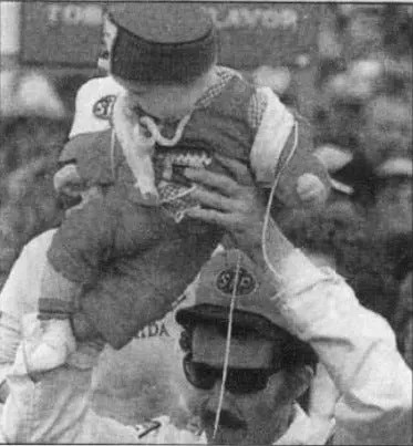 Richard Petty holds his grandson, Adam Petty, after winning the 1981 Daytona 500.