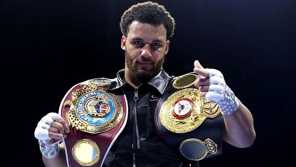 Moses Itauma points his finger and has the WBA International and WBO Inter-Continental heavyweight titles on his shoulders